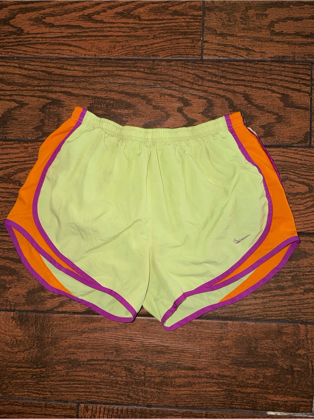 Nike Women’s Neon Yellow Athletic Shorts with Orange Panels and Purple Trim